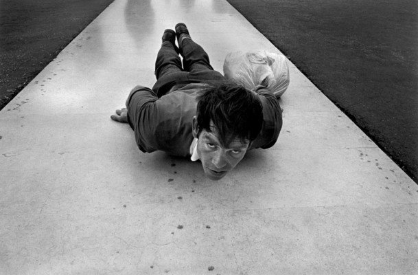PORTUGAL. Fatima. Penitent leaning in front of the Virgin of Fatima.